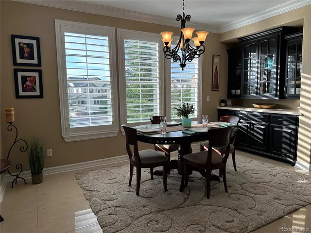 a view of a dining room with furniture and window
