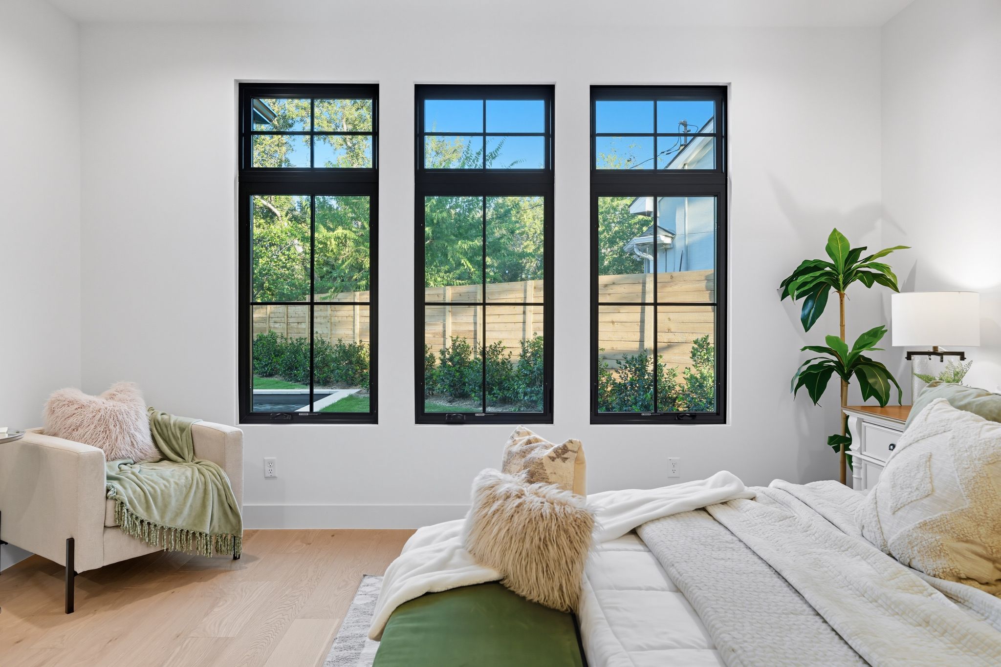 5012 Highland Court Austin, TX 78731 - Photo 19 of 32 Bedroom featuring wood finished floors and baseboards