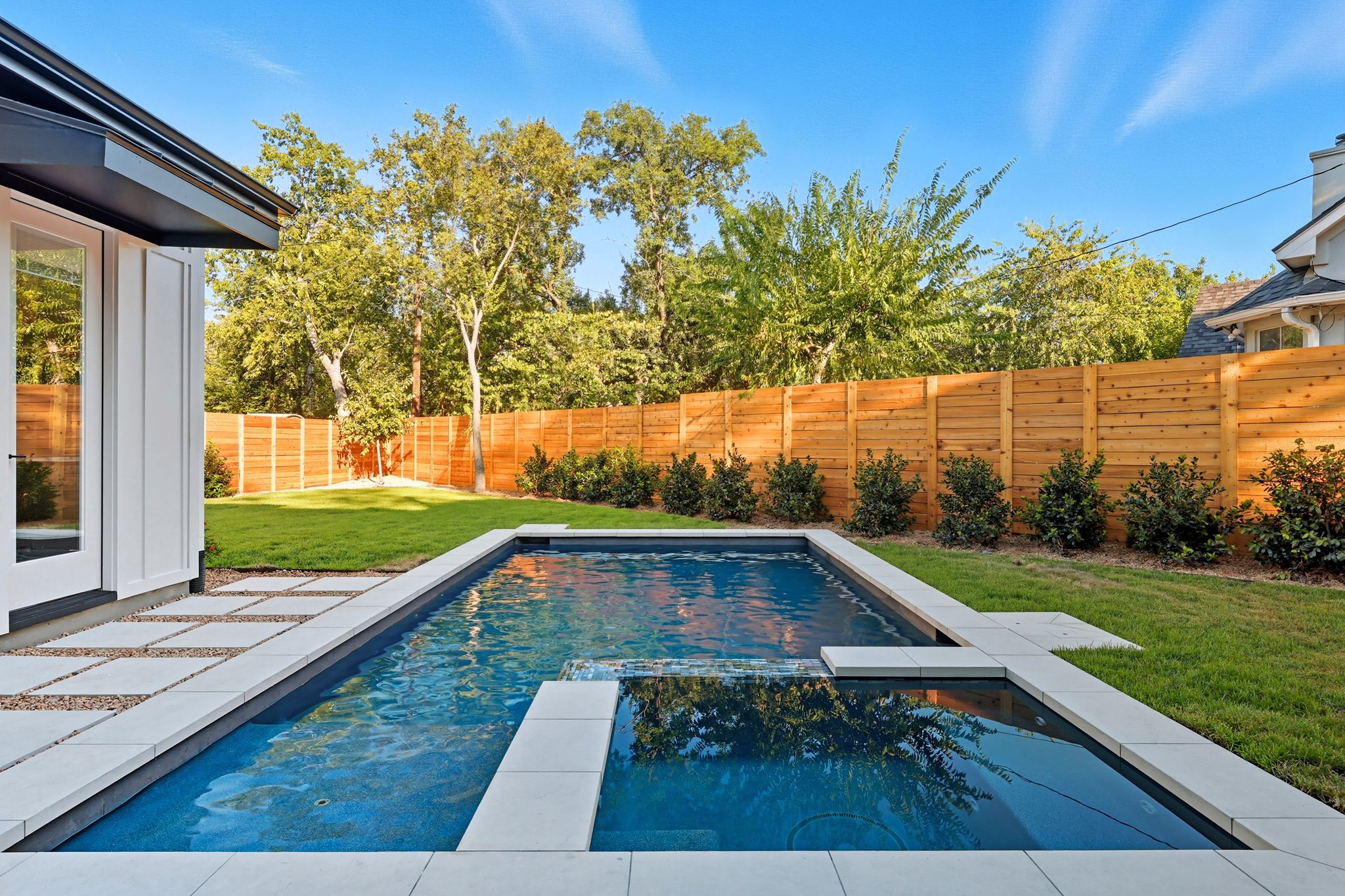 5012 Highland Court Austin, TX 78731 - Photo 31 of 32 View of pool featuring a fenced backyard, a pool with connected hot tub, and a patio area