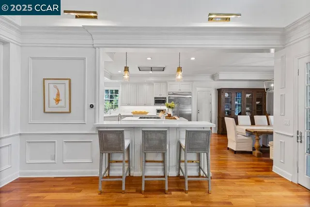 a dining table with kitchen view