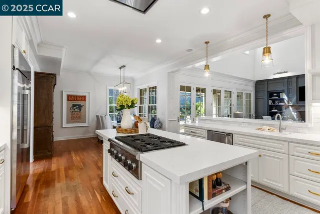 a kitchen that has a stove and a oven