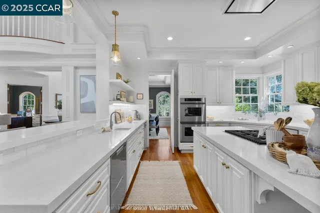 a kitchen with cabinets a sink and appliances