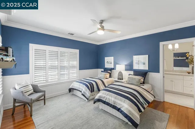 a bedroom with two beds and a couch