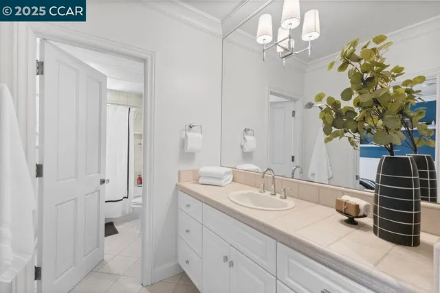 a bathroom with a sink a vanity and a mirror