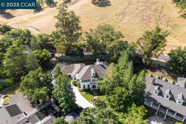 an aerial view of a house with a garden
