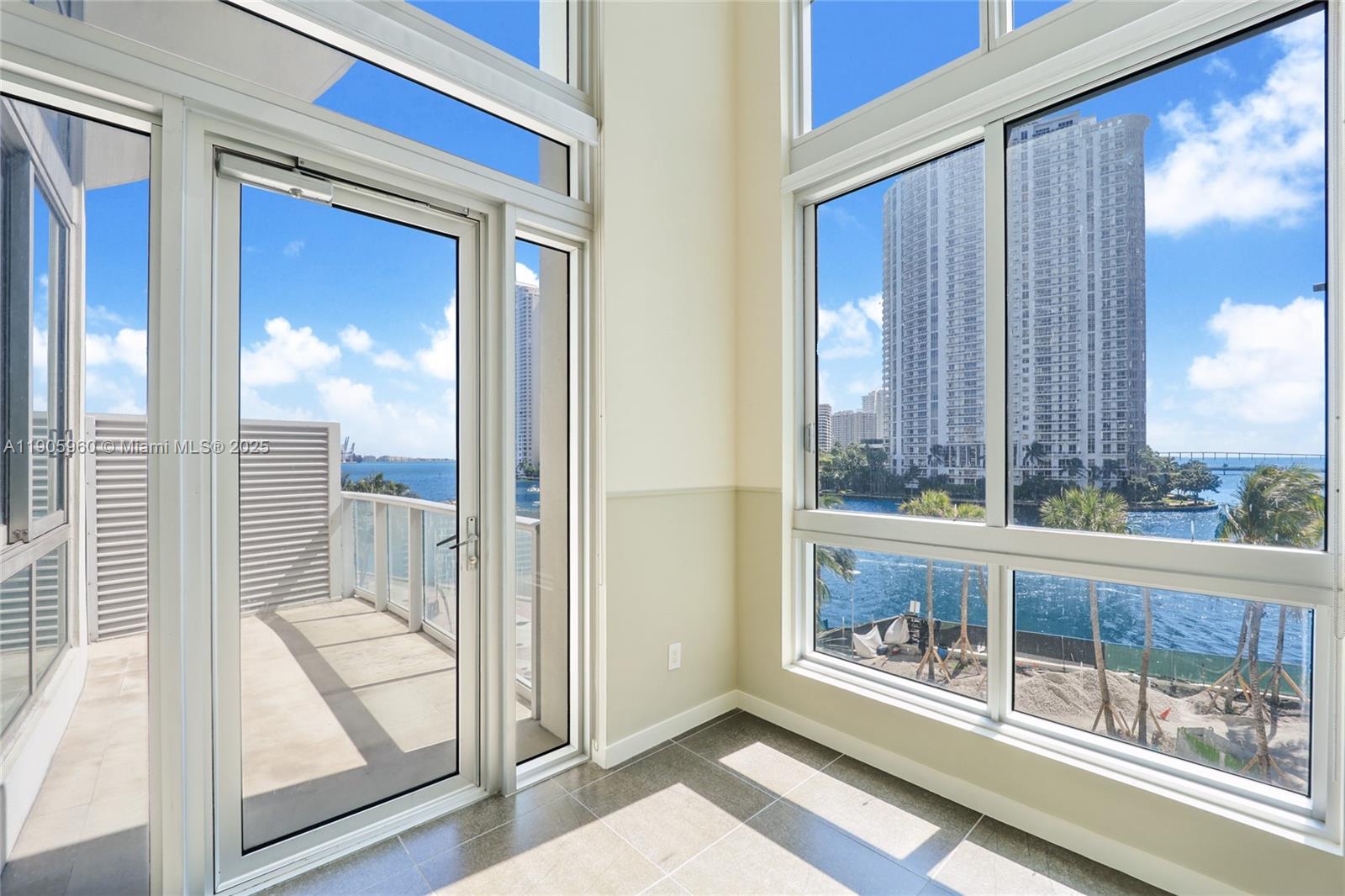 300 South Biscayne Boulevard, Unit L414 Miami, FL 33131 - Photo 7 of 21 a view of a room with a large window and wooden floor