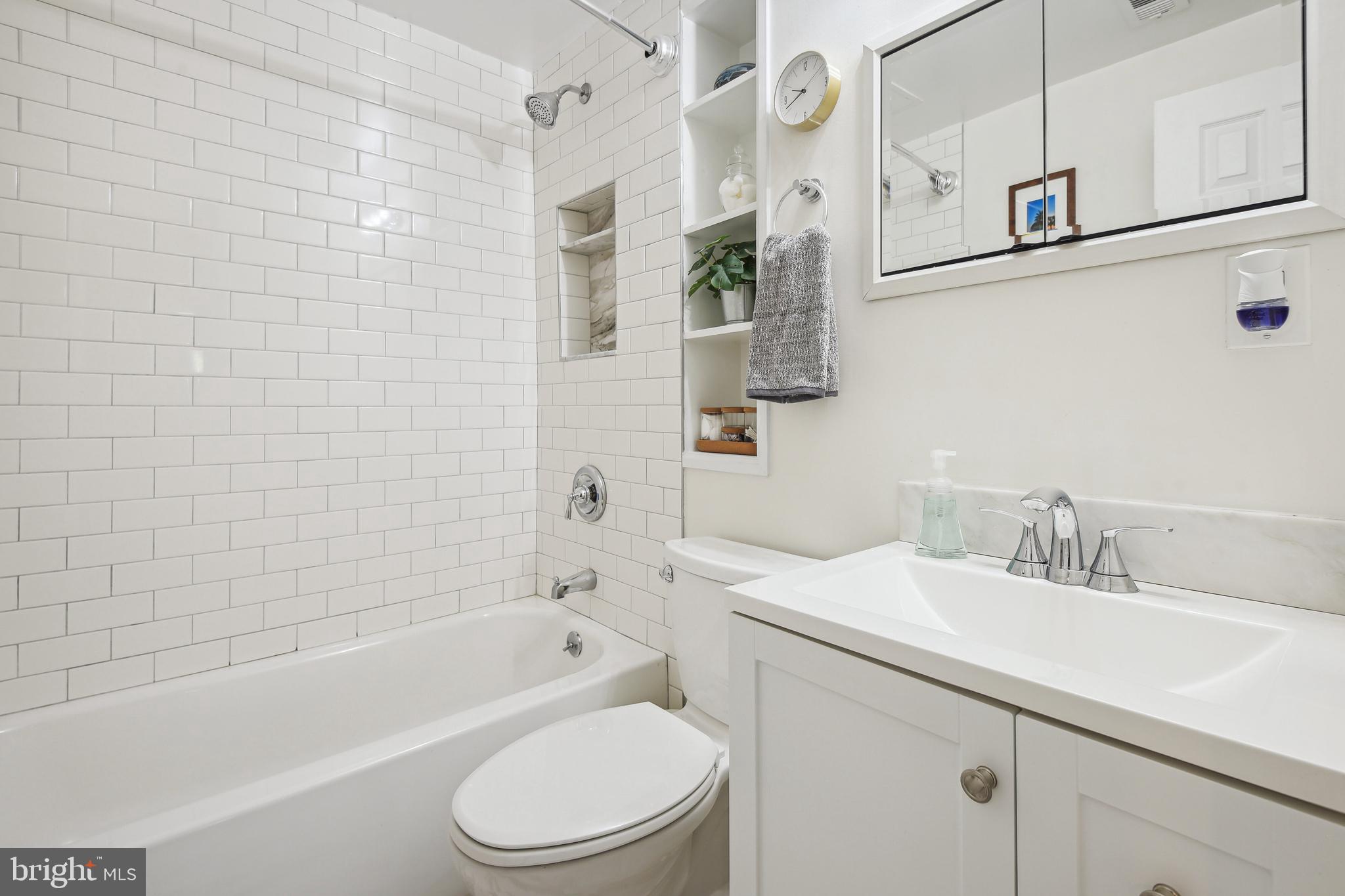 1925 Lyttonsville Road, Unit 1925 Silver Spring, MD 20910 - Photo 18 of 24 Spa-like updated bath w subway tile & tile floor