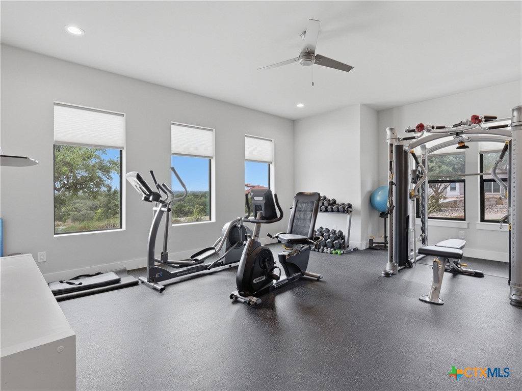5913 Verden Ridge New Braunfels, TX 78132 - Photo 30 of 48 a view of a room with gym equipment
