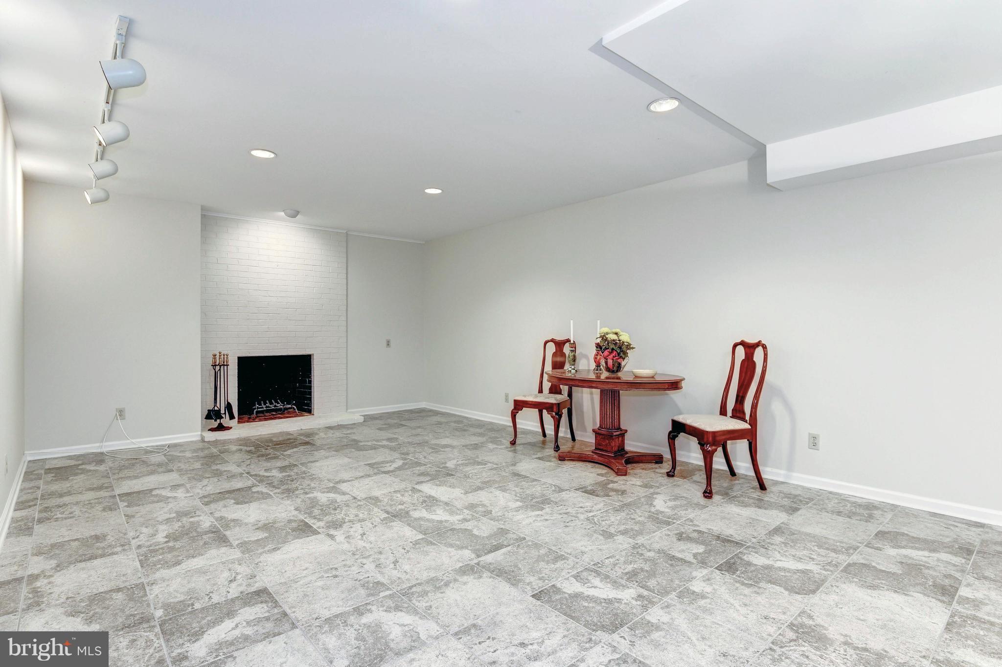4907 Baltan Road Bethesda, MD 20816 - Photo 22 of 26 Renovated Lower Level RecRoom w/ Fireplace