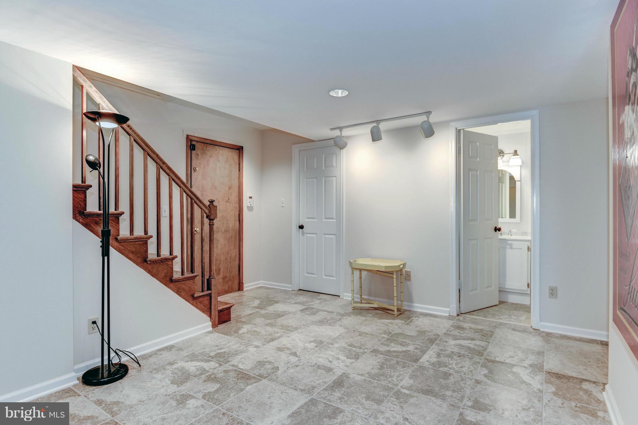 4907 Baltan Road Bethesda, MD 20816 - Photo 24 of 26 New Tile Flooring w/ Entry to 2car Garage