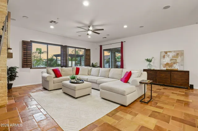 a living room with furniture and a large window