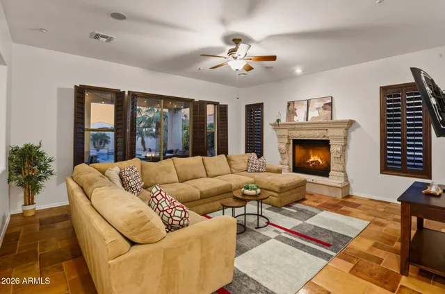 a living room with furniture and a fireplace