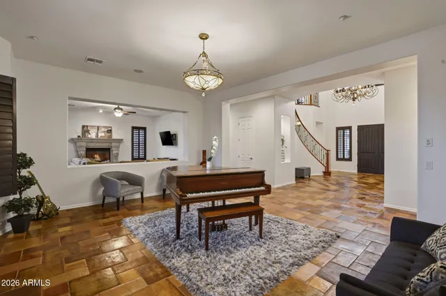 a living room with furniture and a rug