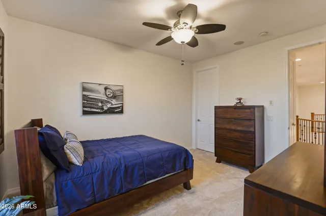 a bedroom with a bed and a dresser