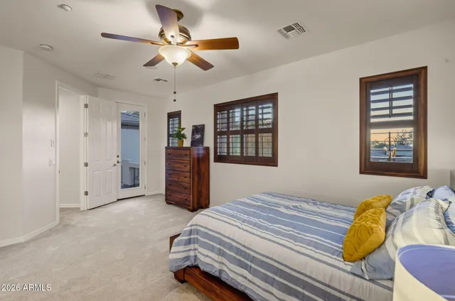 a view of a house with a yard patio and swimming pool