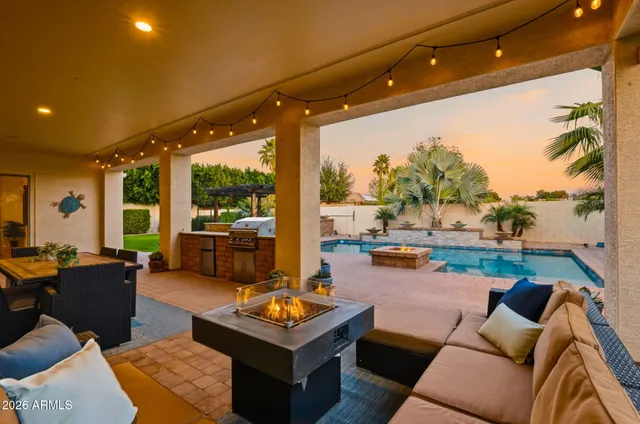 a view of balcony with couch and chairs