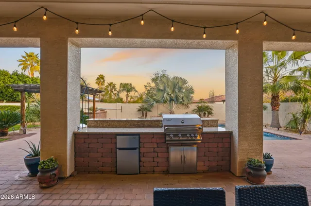 a view of a house with swimming pool and sitting area