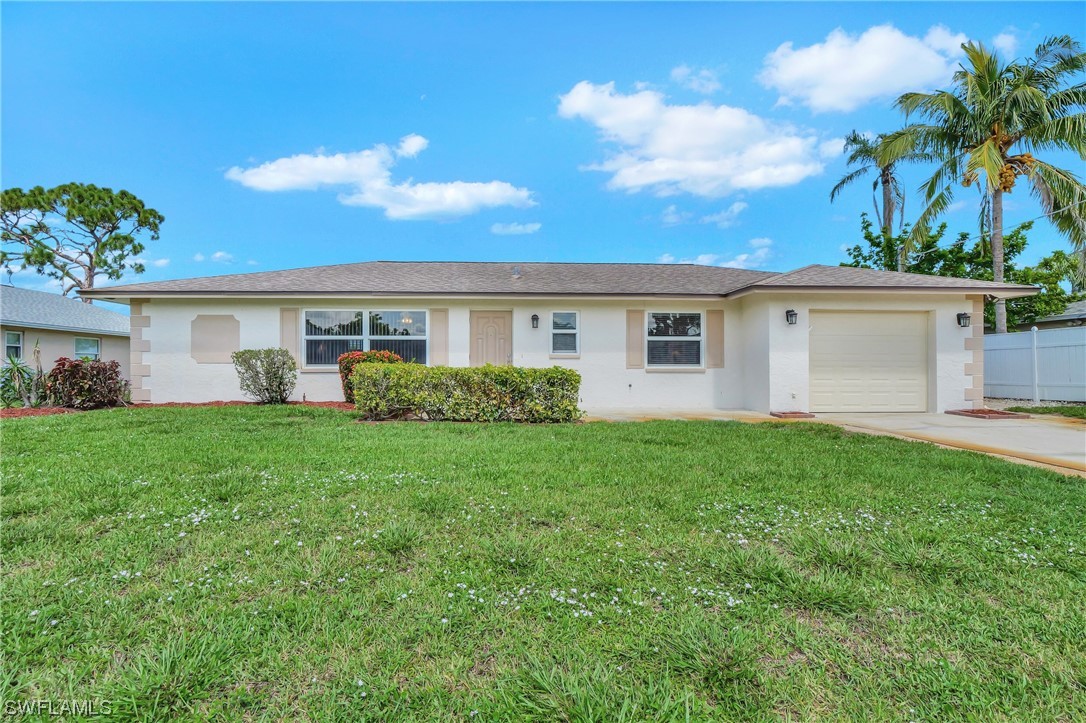 17508 Laurel Valley Road Fort Myers, FL 33967 - Photo 1 of 36 a view of a house with backyard and a garden
