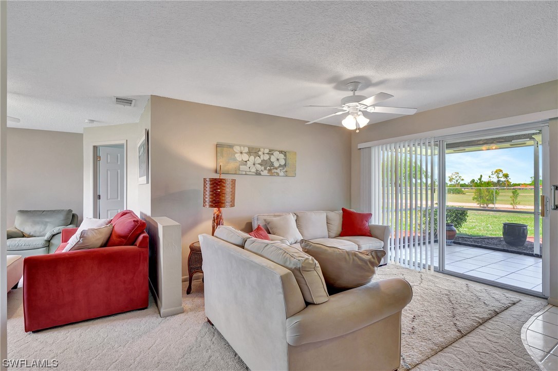 17508 Laurel Valley Road Fort Myers, FL 33967 - Photo 11 of 36 a living room with furniture and a large window