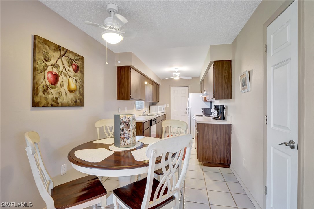 17508 Laurel Valley Road Fort Myers, FL 33967 - Photo 15 of 36 a dining room with furniture and window