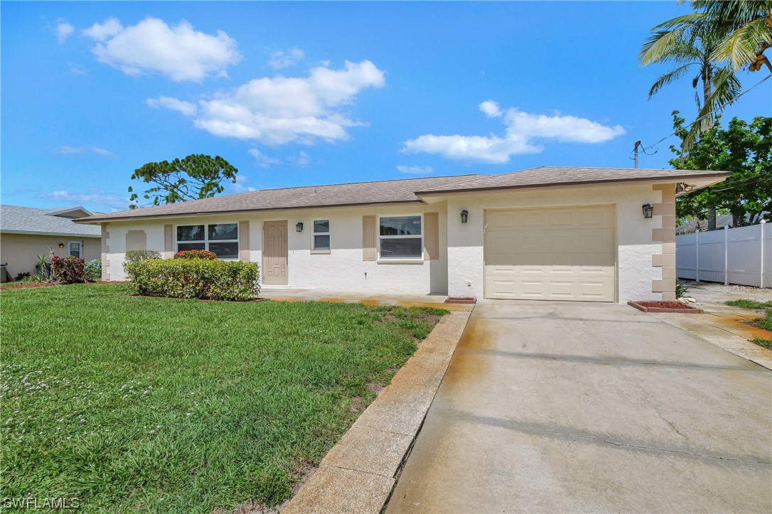 17508 Laurel Valley Road Fort Myers, FL 33967 - Photo 2 of 36 a view of a house with a back yard