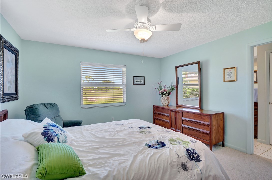 17508 Laurel Valley Road Fort Myers, FL 33967 - Photo 23 of 36 a bedroom with a bed dresser and a window
