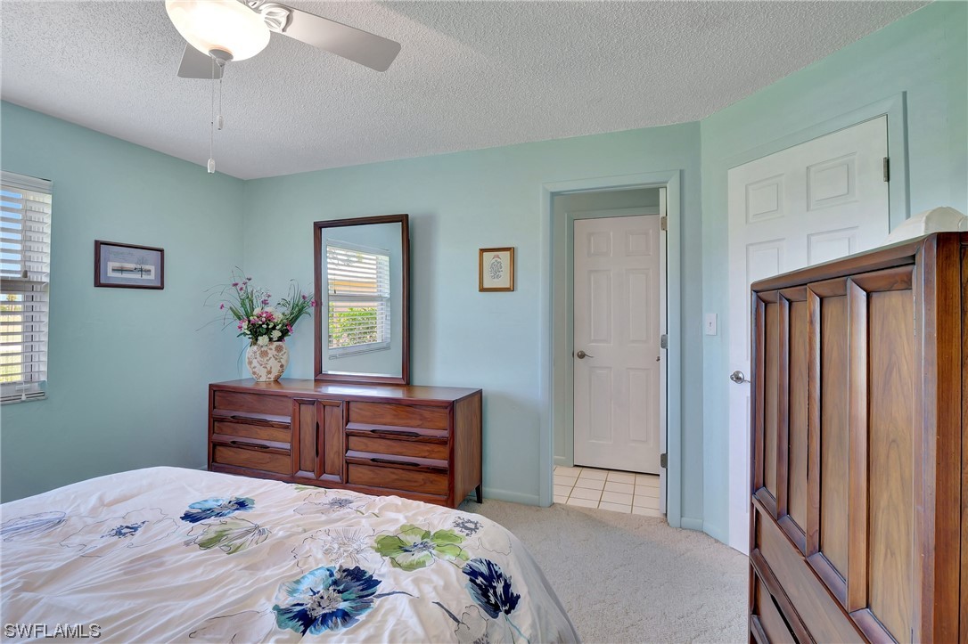 17508 Laurel Valley Road Fort Myers, FL 33967 - Photo 24 of 36 a bedroom with a bed dresser and a window