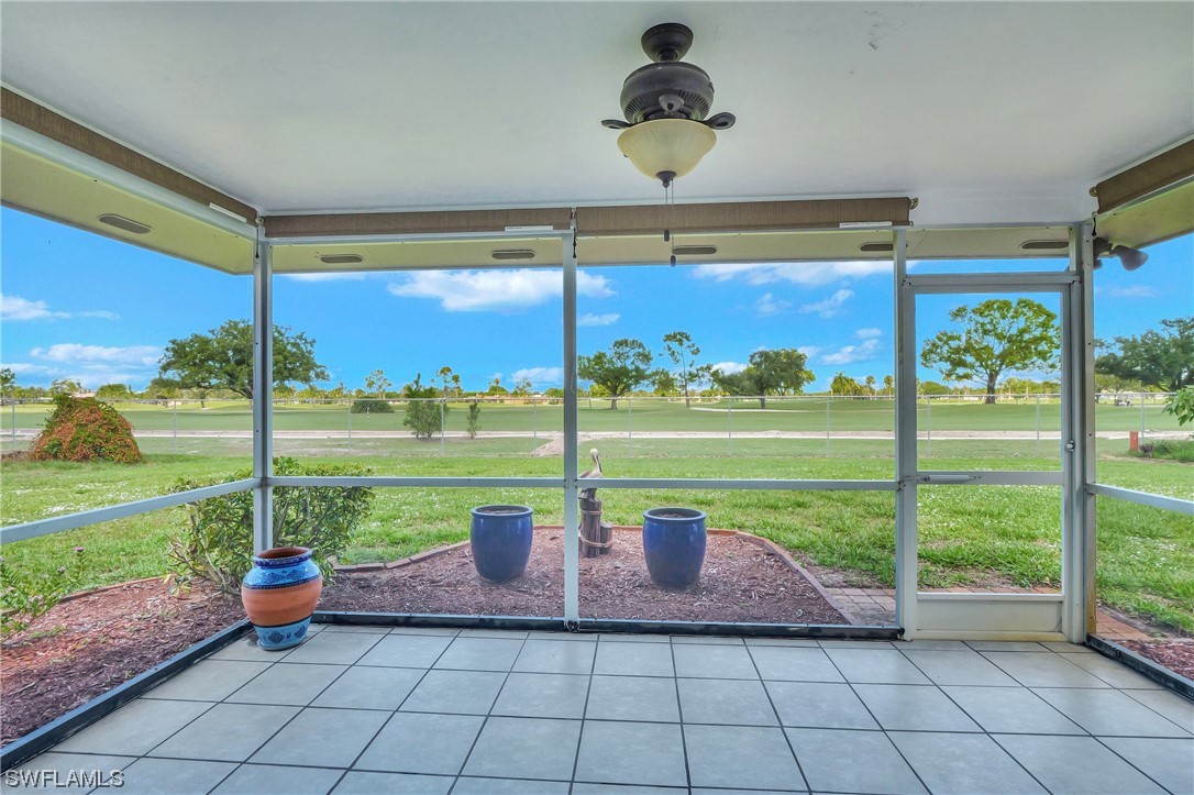 17508 Laurel Valley Road Fort Myers, FL 33967 - Photo 31 of 36 a view of a porch with furniture and yard