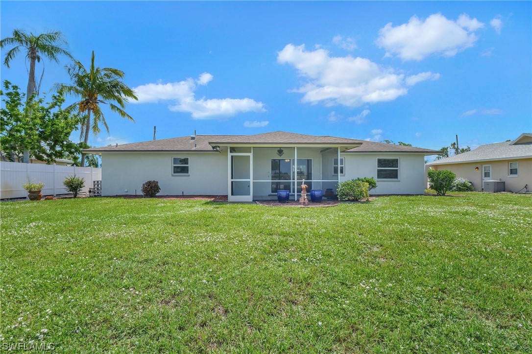 17508 Laurel Valley Road Fort Myers, FL 33967 - Photo 35 of 36 a view of a house with a backyard