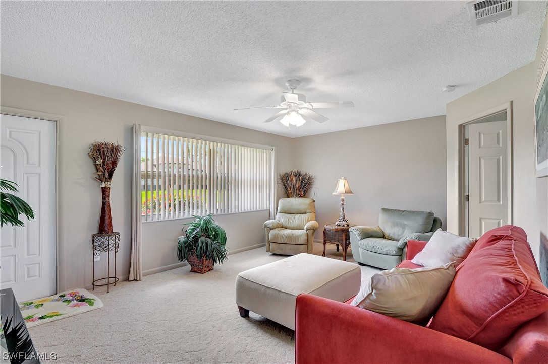 17508 Laurel Valley Road Fort Myers, FL 33967 - Photo 5 of 36 a living room with furniture and a potted plant