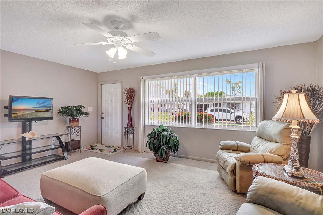 17508 Laurel Valley Road Fort Myers, FL 33967 - Photo 8 of 36 a living room with furniture and a large window