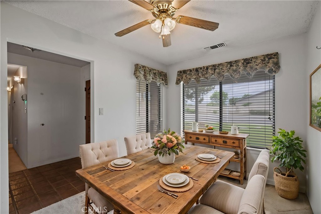 2065 Jenkins Road Bakersfield, CA 93314 - Photo 20 of 59 a view of a dining room with furniture window and wooden floor