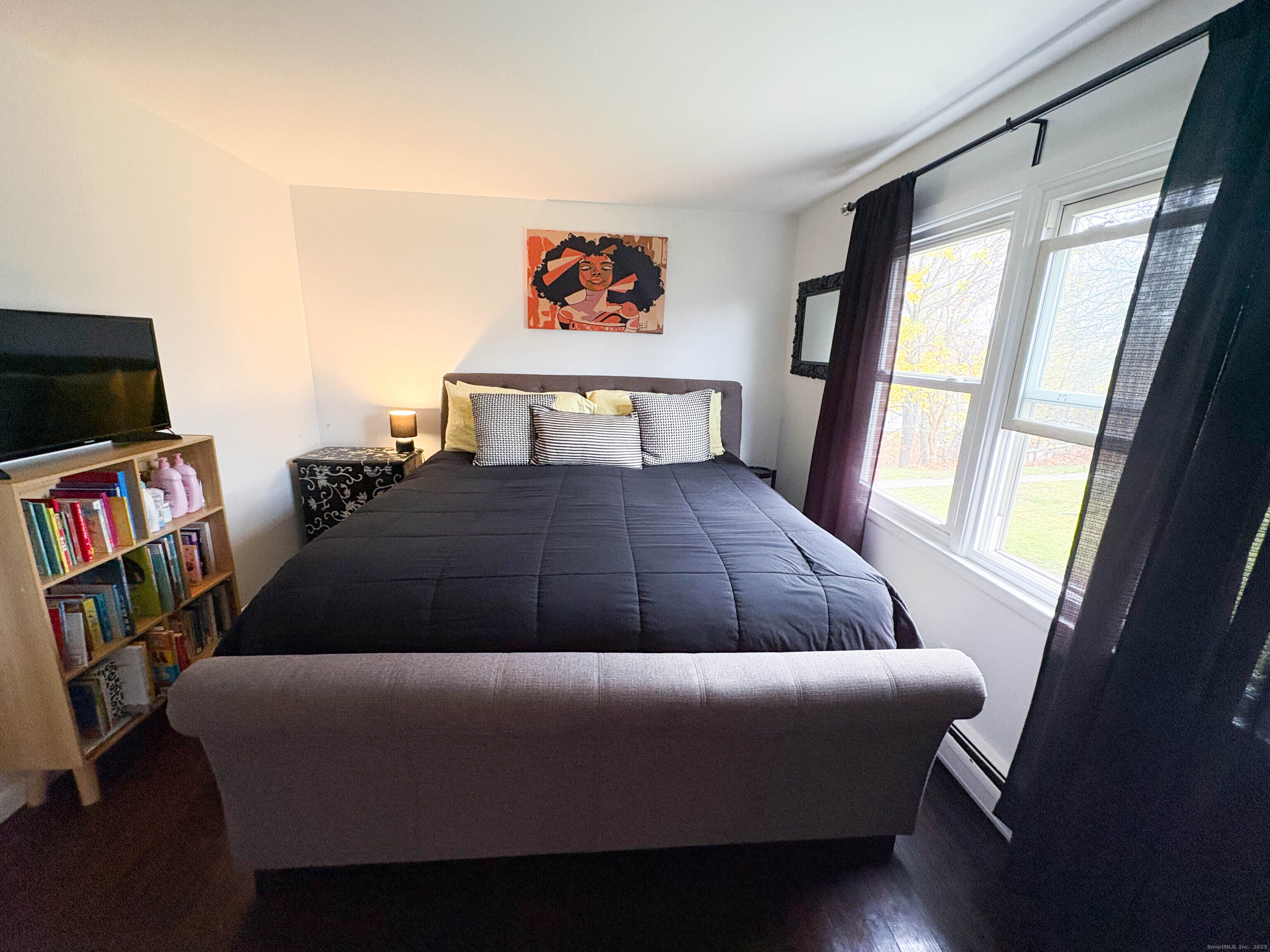 32 Karen Court, Unit B Bridgeport, CT 06606 - Photo 15 of 20 a bedroom with a bed and a book shelf