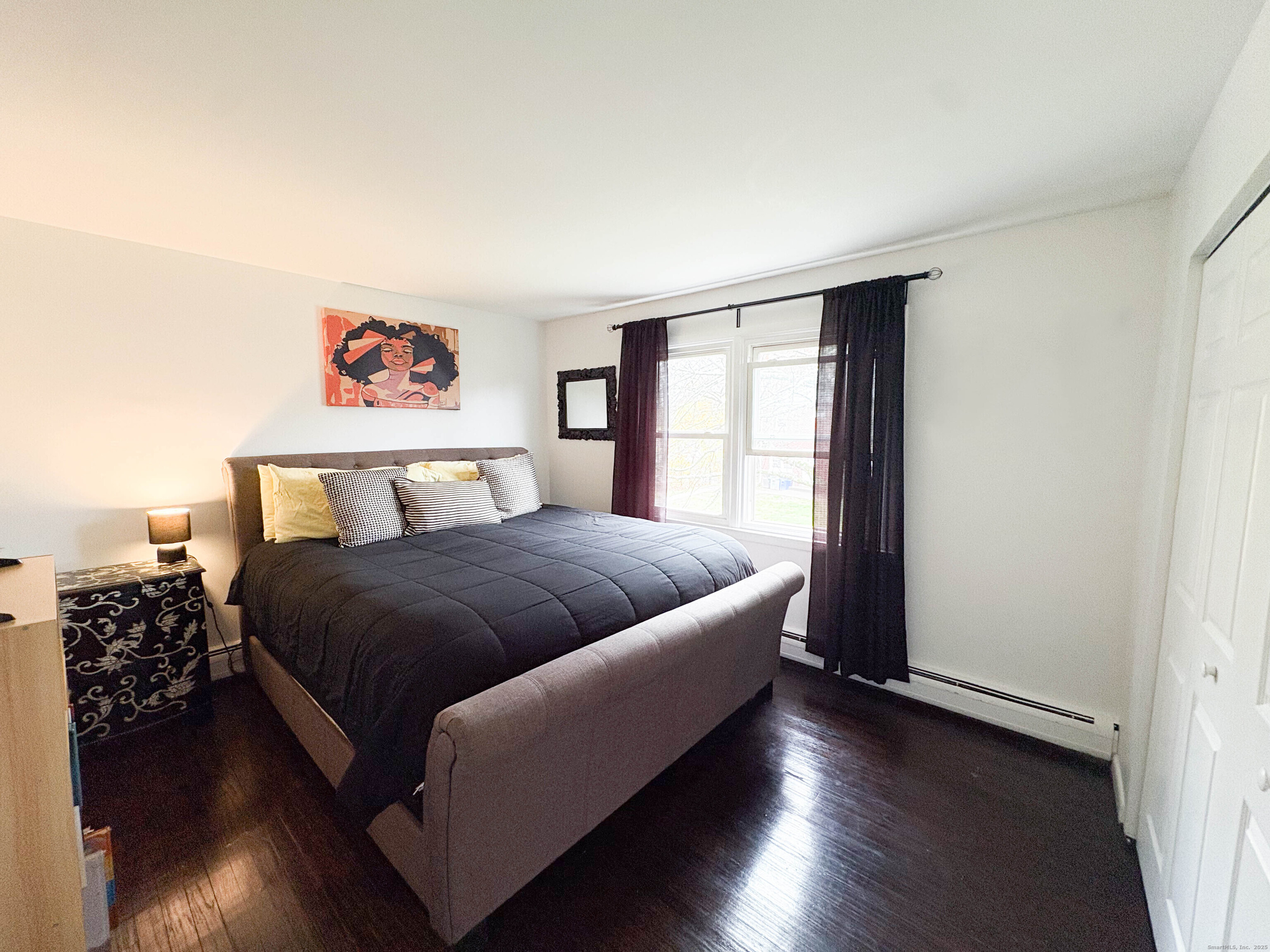 32 Karen Court, Unit B Bridgeport, CT 06606 - Photo 16 of 20 a spacious bedroom with a bed and a window