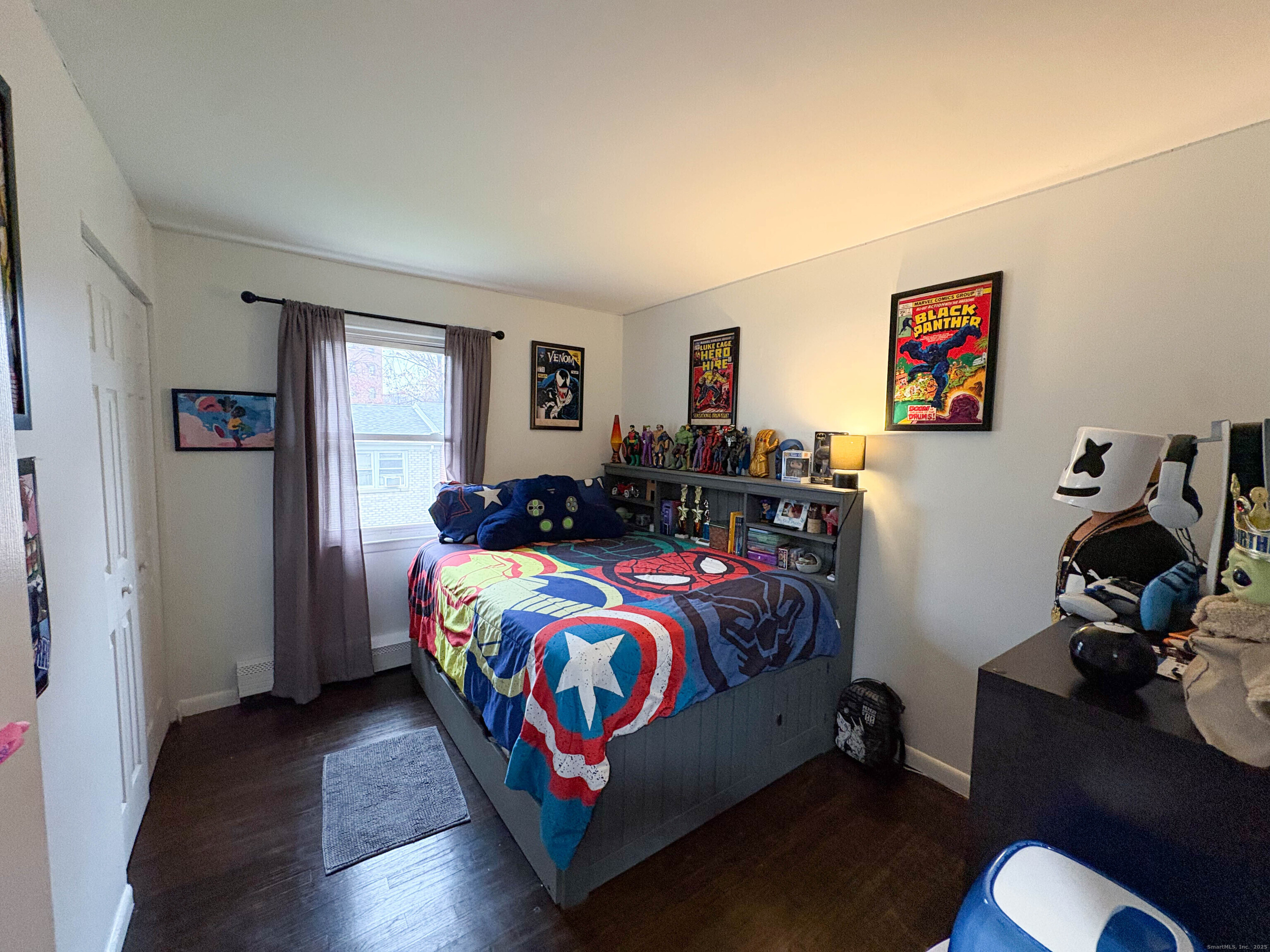 32 Karen Court, Unit B Bridgeport, CT 06606 - Photo 17 of 20 a bedroom with a bed and wooden floor