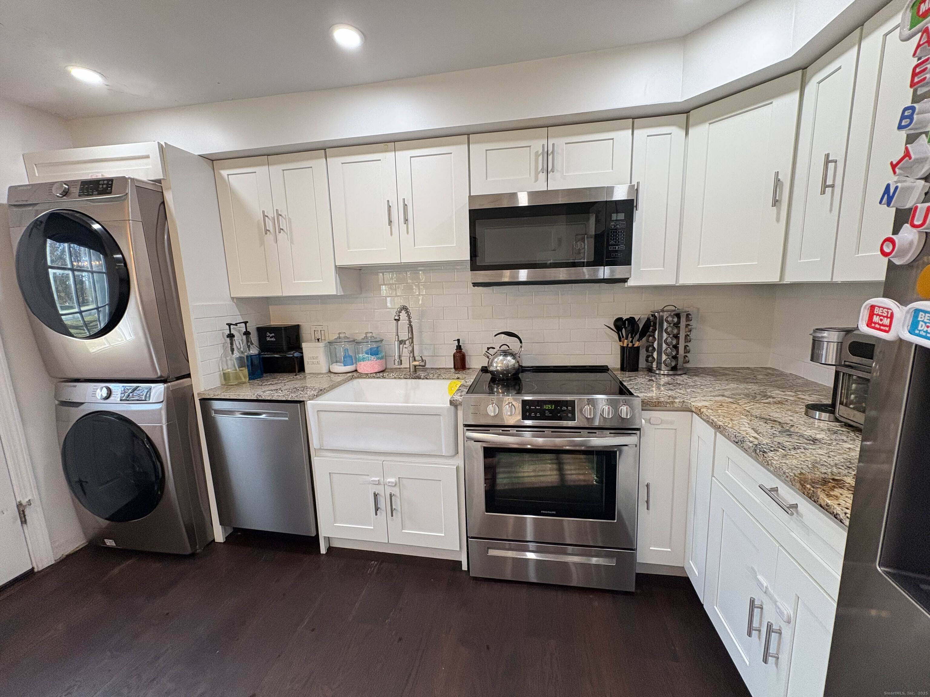 32 Karen Court, Unit B Bridgeport, CT 06606 - Photo 8 of 20 a kitchen with white cabinets and white appliances