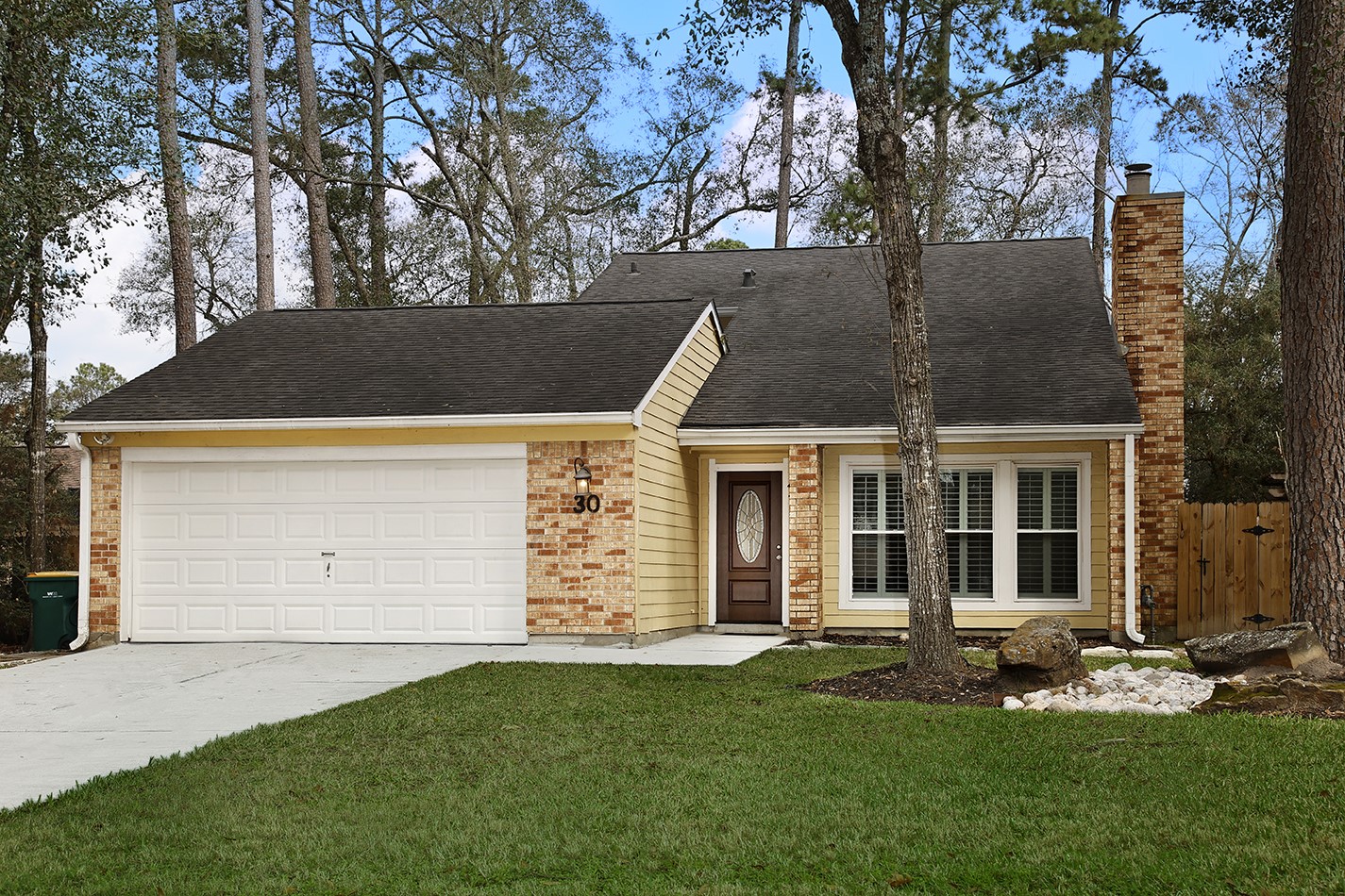 front view of a house with a yard