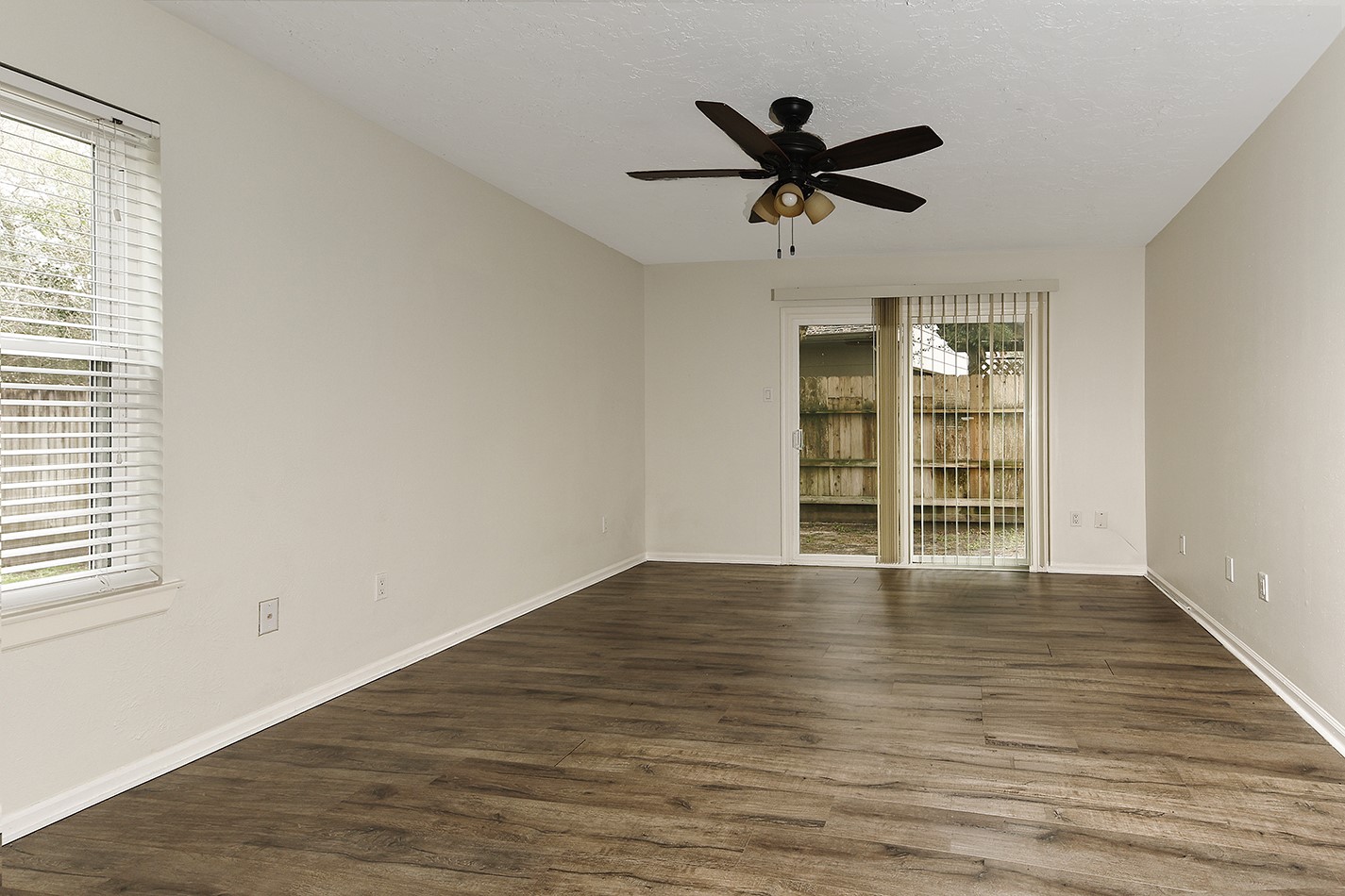 30 Berryfrost Lane Spring, TX 77380 - Photo 11 of 23 a view of empty room with wooden floor and window