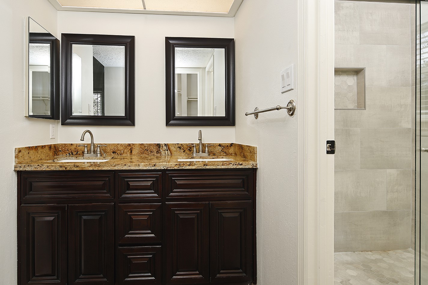 30 Berryfrost Lane Spring, TX 77380 - Photo 15 of 23 a bathroom with a granite countertop sink and a mirror