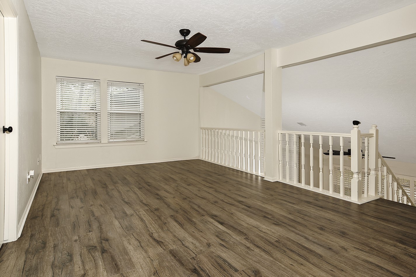 30 Berryfrost Lane Spring, TX 77380 - Photo 16 of 23 a view of empty room with wooden floor and fan