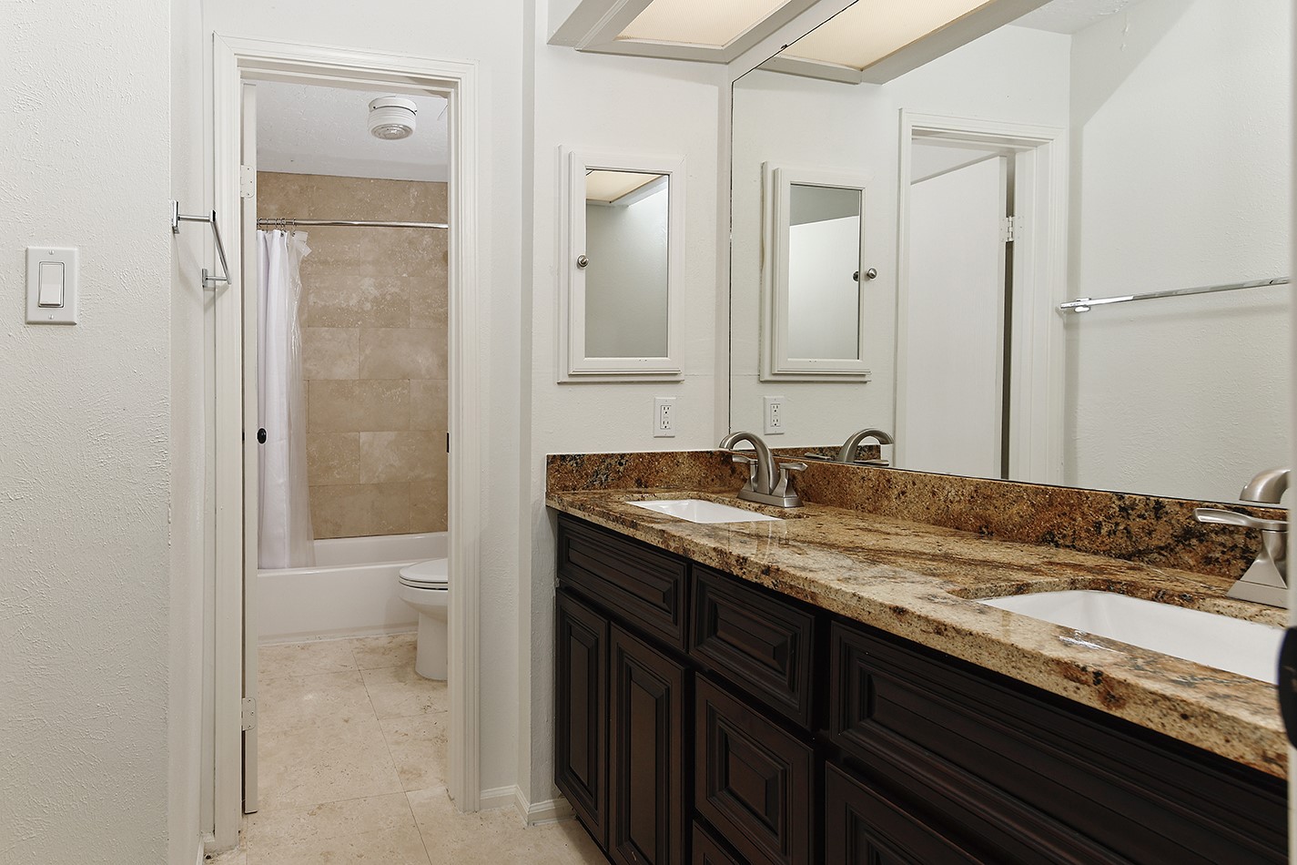 30 Berryfrost Lane Spring, TX 77380 - Photo 18 of 23 a bathroom with a granite countertop sink and a mirror