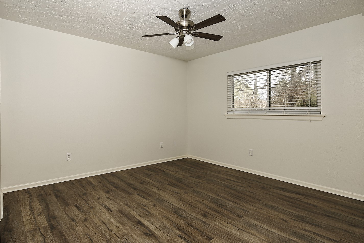 30 Berryfrost Lane Spring, TX 77380 - Photo 19 of 23 an empty room with wooden floor and windows