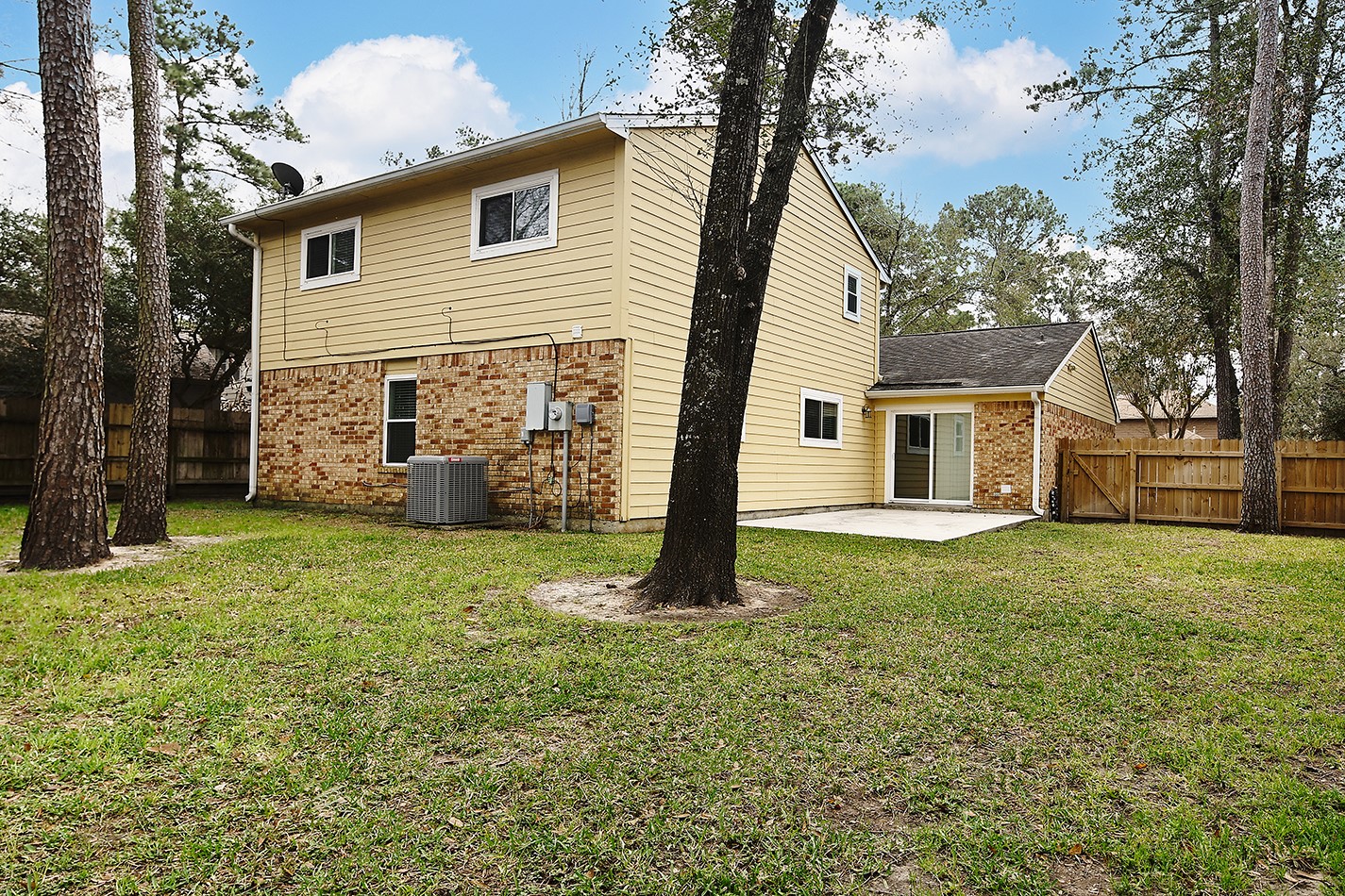 30 Berryfrost Lane Spring, TX 77380 - Photo 22 of 23 a view of a house with backyard and a tree