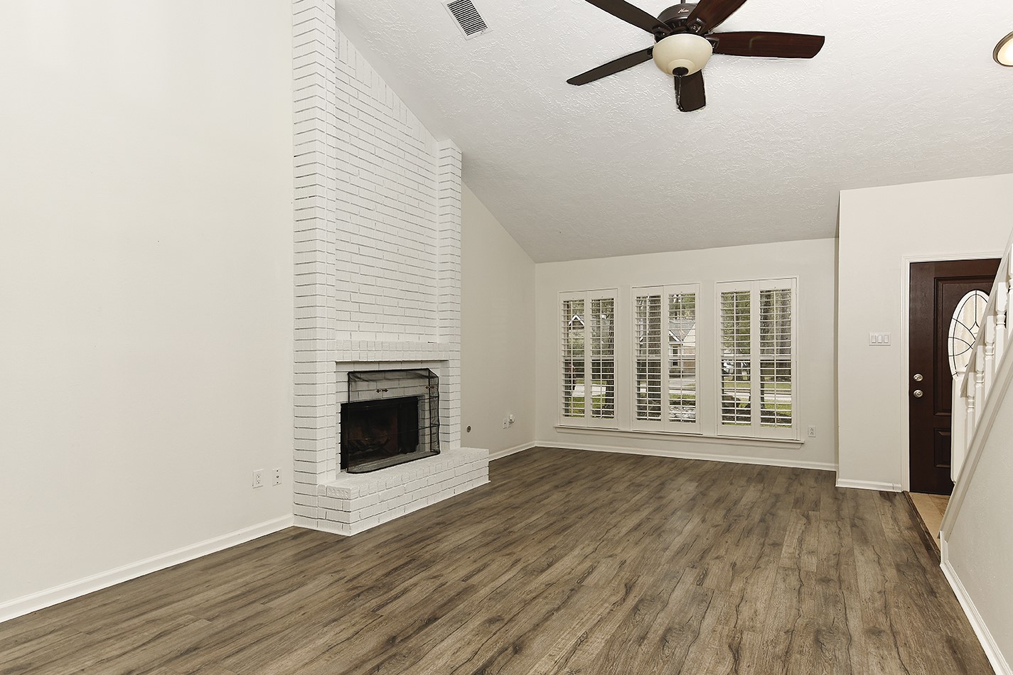 30 Berryfrost Lane Spring, TX 77380 - Photo 4 of 23 a view of an empty room with wooden floor and a window