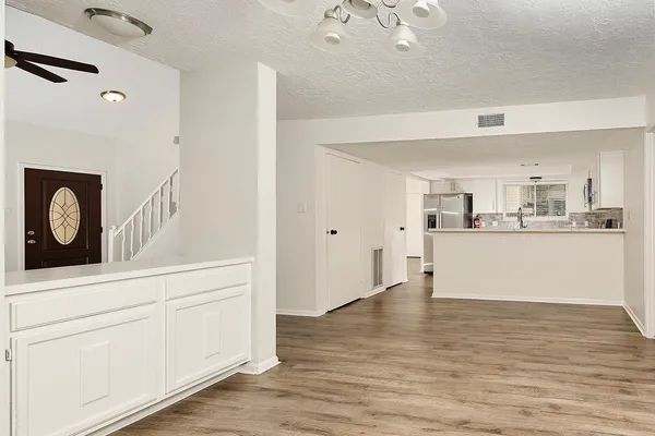 a view of kitchen with wooden floor