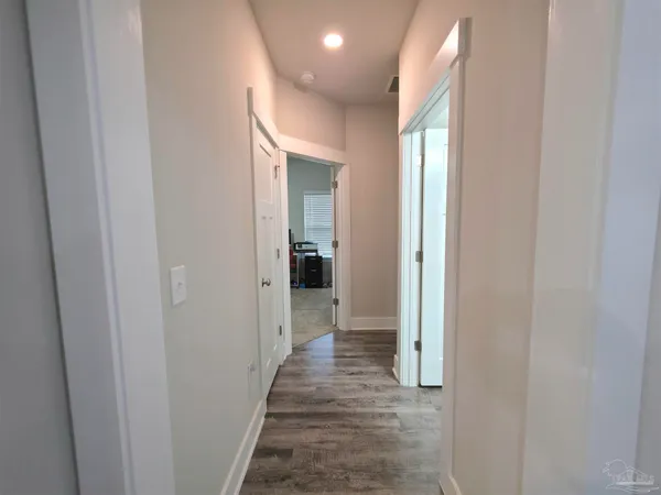 a spacious bedroom with a bed and a couch