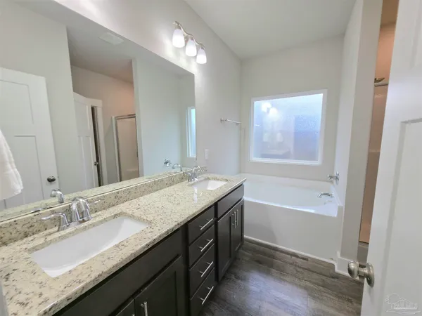 a bathroom with a bathtub and a shower