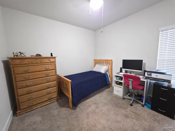 a livingroom with furniture and a flat screen tv