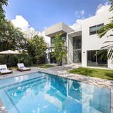 a view of a house with backyard porch and sitting area