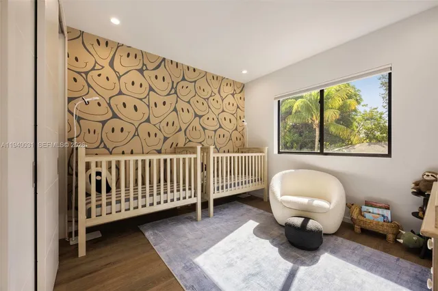 a bedroom with furniture and window